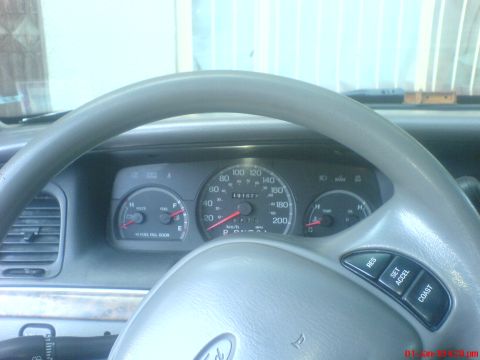 1998 Ford Crown Victoria - Interior view of a 1998 Ford Crown Victoria, showing the dashboard and steering wheel.