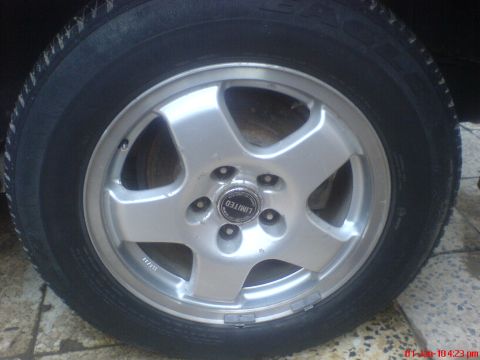 1998 Ford Crown Victoria - This photo shows a single wheel with a 'LIMITED' center cap, not a 1998 Ford Crown Victoria.