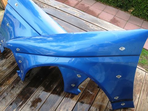 1986 Ford Bronco - This blue Autofab hood and fender assembly is shown with numerous rivets securing the panels together.