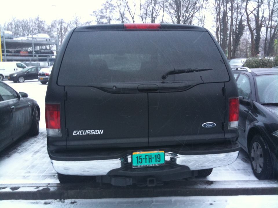 Black Ford Excursion rear with license plate 15-FH-19