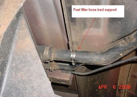 2007 Ford Mustang - The fuel filler hose is secured by clamps to a support bracket. A date stamp is visible in the lower right corner.