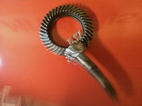 2002 Chevrolet Camaro - A close-up of a ring gear with an "LS1" emblem, likely a differential component.