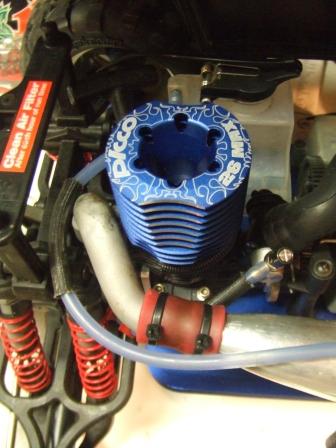 1996 Ford Bronco - Close-up of a blue Picco R21 MAX engine cylinder, part of an RC car.