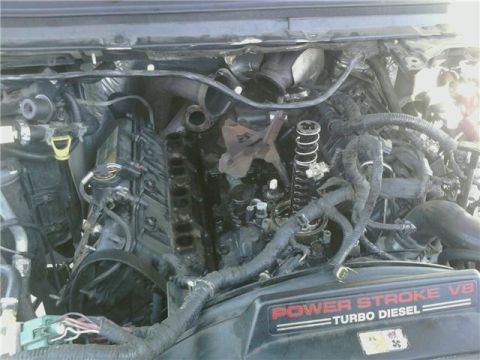 1995 Ford Bronco - Close-up of a Power Stroke V8 Turbo Diesel engine, likely from a Ford Super Duty truck.