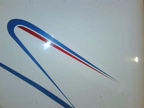 2003 Peterbilt 379 - Detail of a white truck's side blue and red racing stripes.