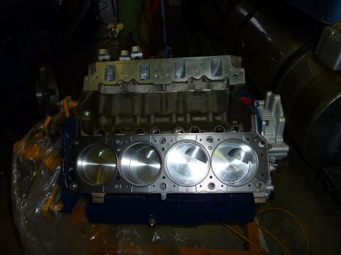 1971 Ford Mustang - Engine block with pistons exposed, likely during a rebuild or build process.