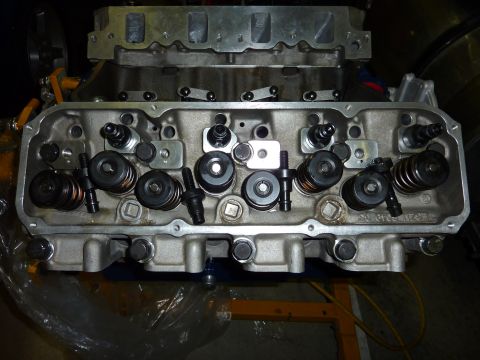 1971 Ford Mustang - Close-up of an engine cylinder head, showing internal components like valves and springs.