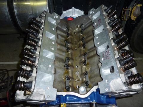 1971 Ford Mustang - Close-up view of a V8 engine block and its attached cylinder heads, showing internal components.
