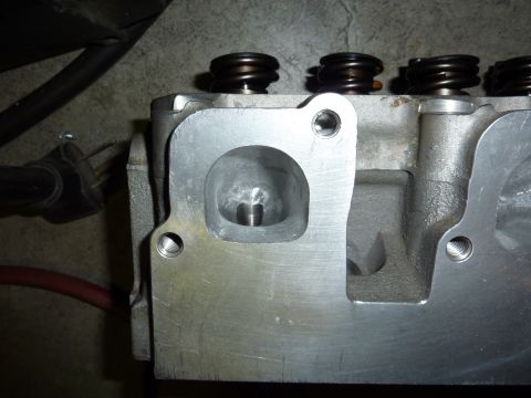 1971 Ford Mustang - This is a close-up view of an engine cylinder head, showing the intake port and valve springs.