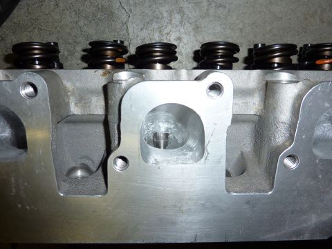 1971 Ford Mustang - Close-up of an engine cylinder head, showing valve springs and ports.