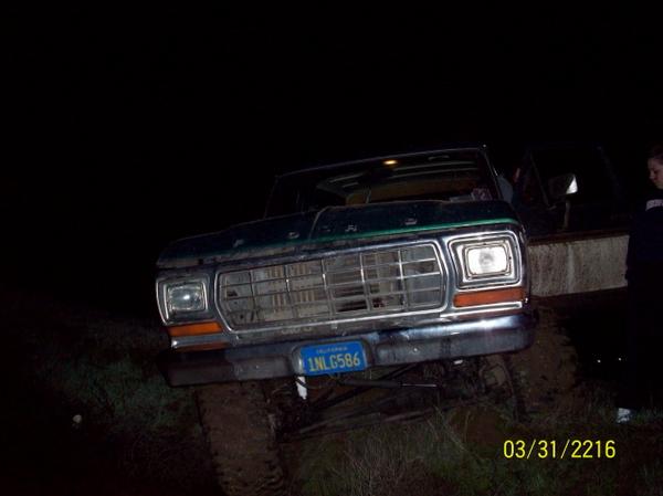 Front view of a green Ford F-Series truck, possibly a 1979 model, with a license plate reading 1NL G586