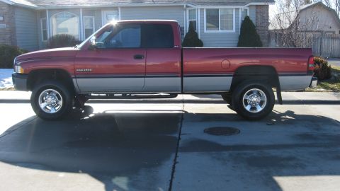 1997 Dodge 2500 - Side profile of a 1997 Dodge 2500 pickup truck parked on a driveway.