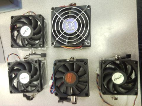 2007 Subaru Impreza - Collection of computer CPU coolers, including several with AMD branding.