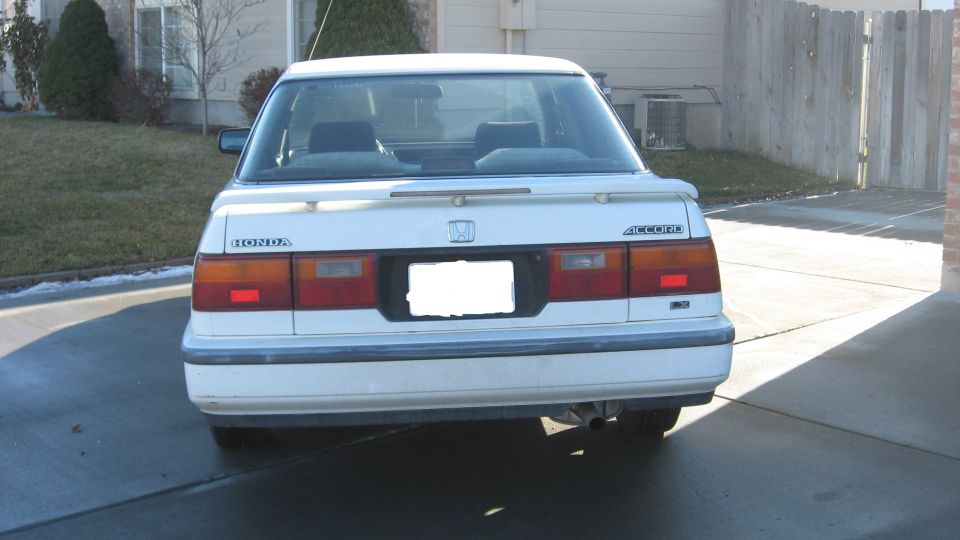 Rear view of a white 1989 Honda Accord with a spoiler