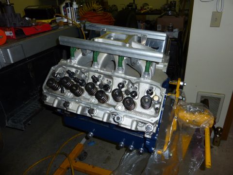 1971 Ford Mustang - Close-up of a V8 engine block assembly, showing valve train components and intake manifold.