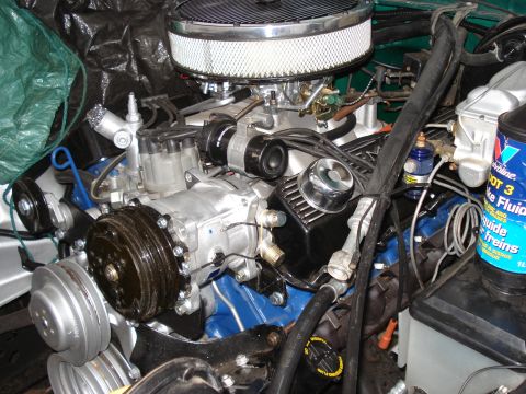 1979 Ford F-150 - Close-up view of a V8 engine, likely from a truck or older car, with various components visible.