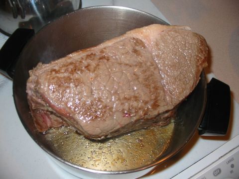 1992 Ford Bronco - Beef roast is cooking in a pan with oil.