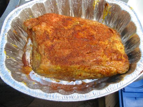 1992 Ford Bronco - A seasoned roast sits in a disposable foil pan, ready for cooking.