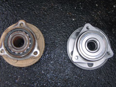 2003 Jeep Wrangler - Comparison of a used wheel hub assembly with a new one.