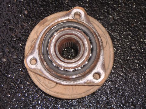 2003 Jeep Wrangler - Close-up view of a used wheel hub assembly, showing wear on the bearing and splines.