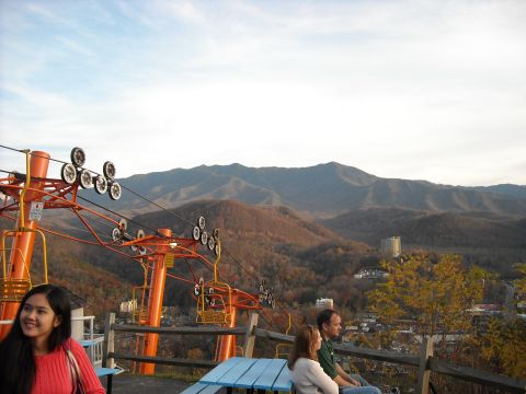 1979 Ford F-150 - A scenic view of mountains and a ski lift with people enjoying the scenery.