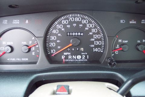 2001 Ford Crown Victoria - The dashboard gauges of a 2001 Ford Crown Victoria show the odometer reading 110,684 miles.