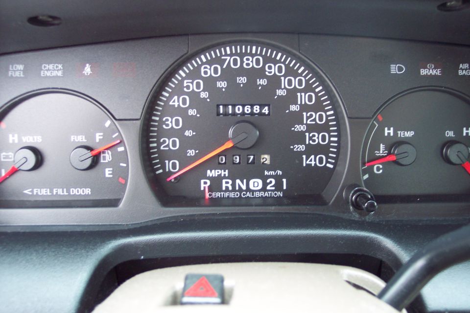 Dashboard gauges with odometer showing 110684 miles and speedometer up to 140 mph
