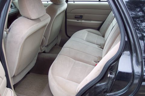 2001 Ford Crown Victoria - Interior view of the back seat and door panel of a 2001 Ford Crown Victoria.