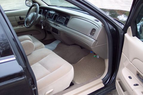 2001 Ford Crown Victoria - Interior view of a 2001 Ford Crown Victoria, showing the front seats and dashboard.