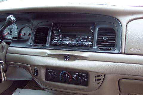 2001 Ford Crown Victoria - Interior view of a 2001 Ford Crown Victoria dashboard, showing the radio and climate controls.