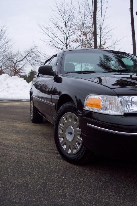 2001 Ford Crown Victoria - Front quarter view of a black 2001 Ford Crown Victoria in winter conditions.