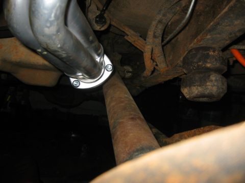 1995 Ford Bronco - Underbody view showing exhaust manifold, driveshaft, and suspension parts.