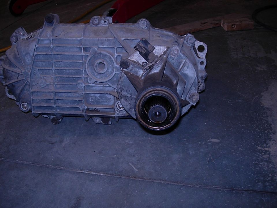 Gray metal transfer case with splined output shaft and electrical connector