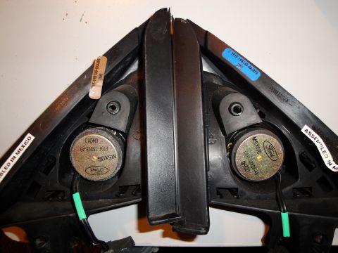 1993 Ford Taurus - Two Ford door speakers are shown, with part numbers and assembly information visible on the plastic housing.