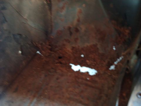 1978 Ford Mustang II - Close-up view of heavily rusted metal, possibly from a vehicle's undercarriage, with a Supermotors.net watermark visible.