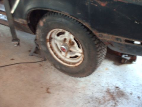 1978 Ford Mustang II - This photo shows a close-up of a car's wheel and fender, with visible rust.