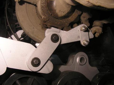 1987 Suzuki Samurai - This image shows a close-up view of a vehicle's suspension system, focusing on a modification kit.