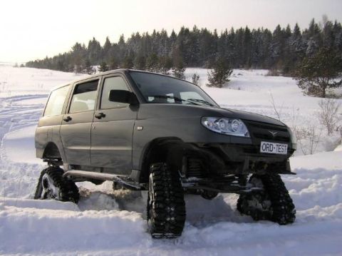 1987 Suzuki Samurai - This modified UAZ Patriot SUV is equipped with snow tracks for off-road travel in winter conditions.