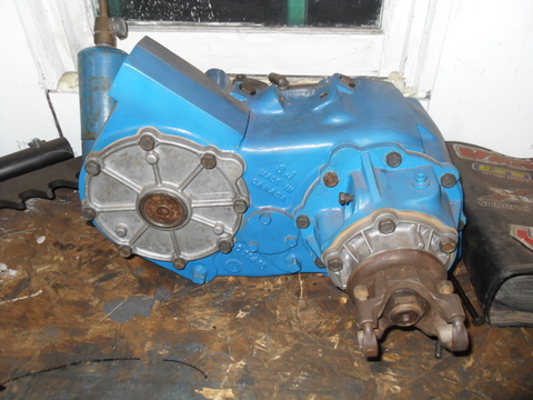 1997 Ford Ranger - A blue transfer case sits on a workbench, showing some visible text on its casing.