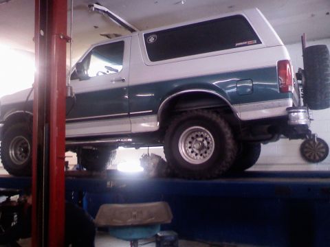 1996 Ford Bronco - Up on the lift, gettin the trans re-built