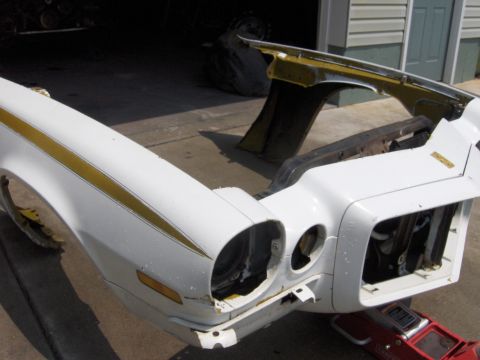 1971 Chevrolet Camaro - The front clip of a 1974 Chevrolet Camaro shows damage and missing components.
