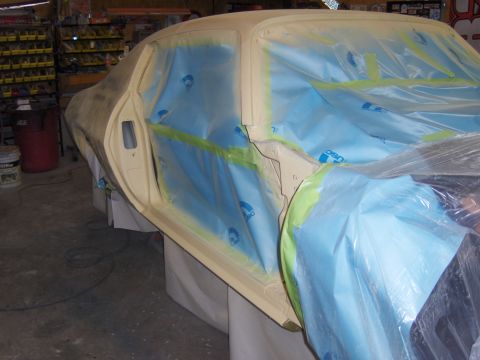 1971 Chevrolet Camaro - Car body undergoing preparation for painting, with masking in place.