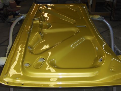 1971 Chevrolet Camaro - The inside of a freshly painted car door is visible, with metal bracing and mounting points.