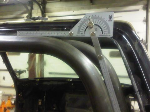 1996 Ford Bronco - A protractor is used to measure the angle of a custom roll cage inside a vehicle.