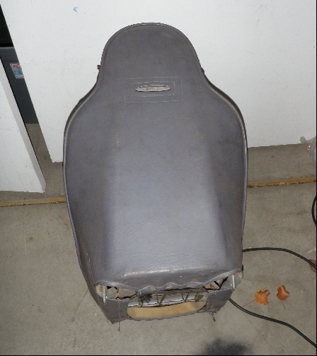 1994 Ford Bronco - A gray car seat is shown from the rear, revealing its internal structure and springs.