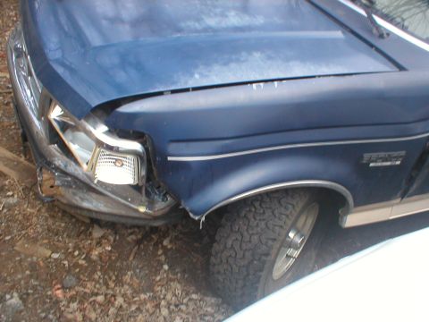 1993 Ford Bronco - This vehicle has significant damage to its front end, including the fender and headlight assembly.