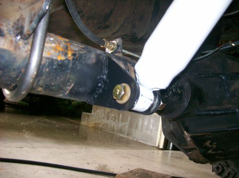 1989 Ford Bronco - This photo shows a close-up view of a vehicle's rear axle and shock absorber mounting hardware.