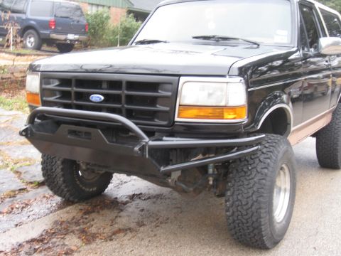 1994 Ford Bronco - Front view of a 1994 Ford Bronco modified with a heavy-duty bumper and larger tires.