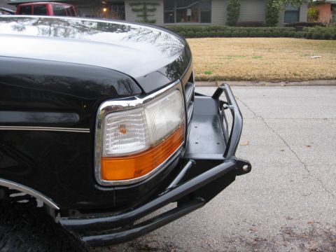 1994 Ford Bronco - Front view of a black truck with a heavy-duty aftermarket bumper installed.
