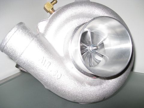 1994 Ford Probe - A silver turbocharger with "AIR 50" visible on its housing is shown in a close-up view.